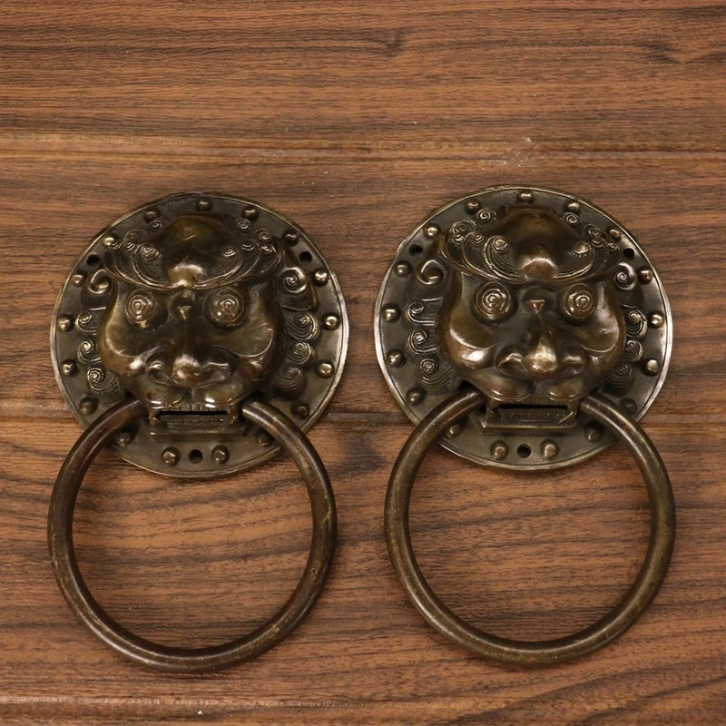 Antique miscellaneous collectibles: a pair of vintage brass lion door knocker ornaments for decoration