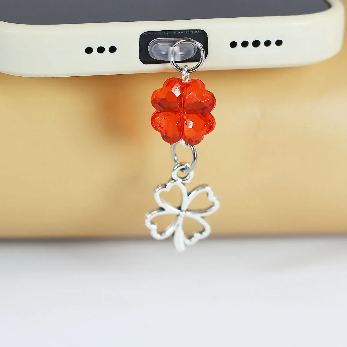 Mobile phone dustproof plug, heart lucky clover pendant pendant, hollowed out heart-shaped flower, mobile phone accessories