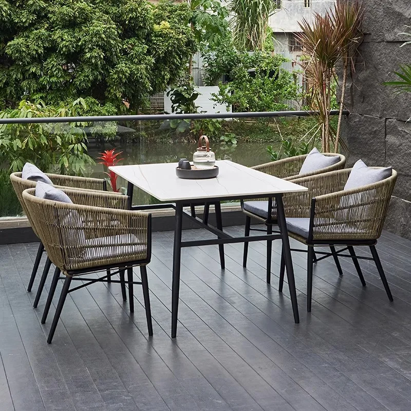 Outdoor courtyard tables and chairs High-end villa garden rattan chair rock slab furniture Outdoor waterproof and sunscreen balc