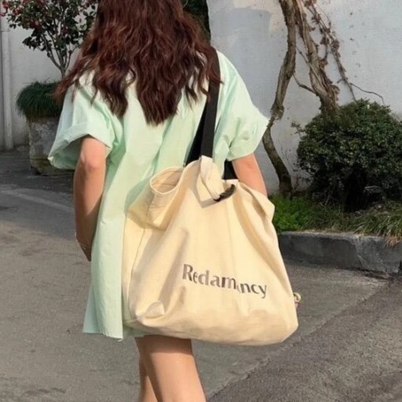 GUMUNI Trendy Cool English Word Printed Canvas Bag Large Capacity Handheld Commuter Shoulder Bag Casual Minimalist Style