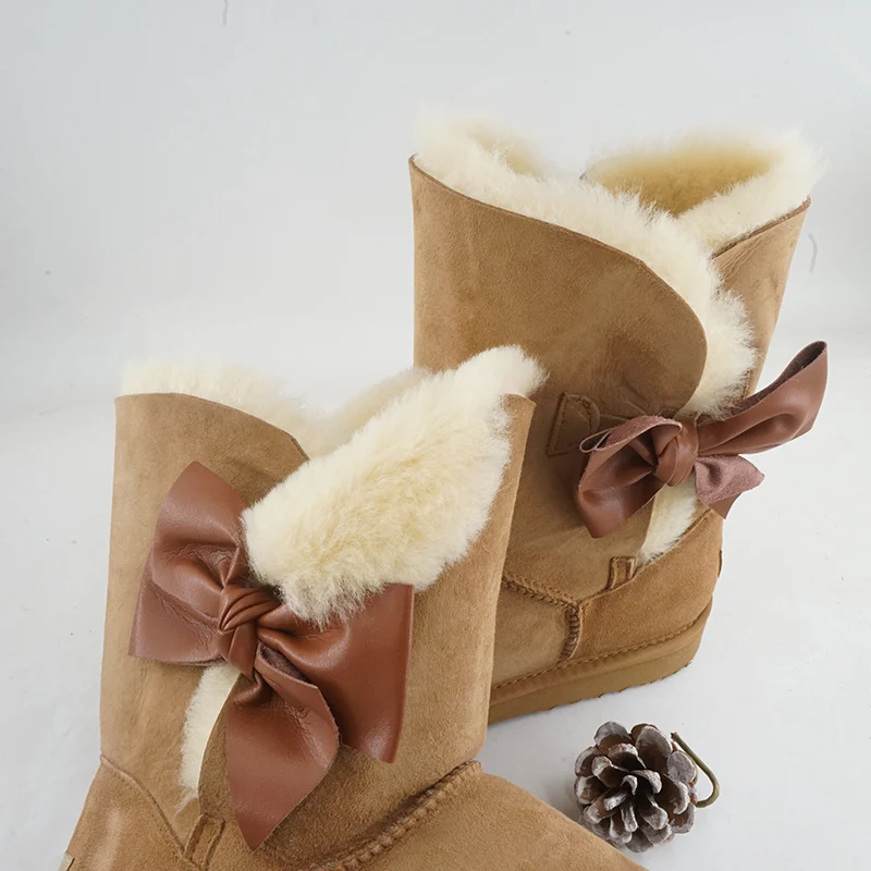 Moda laço botas de neve de pele natural novos sapatos femininos pele de carneiro genuína pele real 100% lã inverno meados de bezerro botas de neve