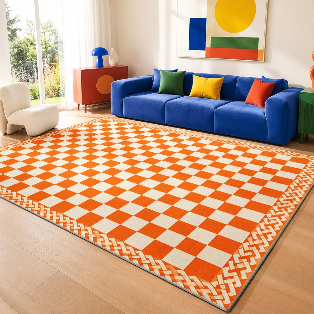 A Vibrant Orange-Colored Checkerboard Rug, Featuring A Neat Geometric Grid Pattern Paired with A Woven Decorative Border and Printed Design, Suitable for Decorating Any Home or Living Space.