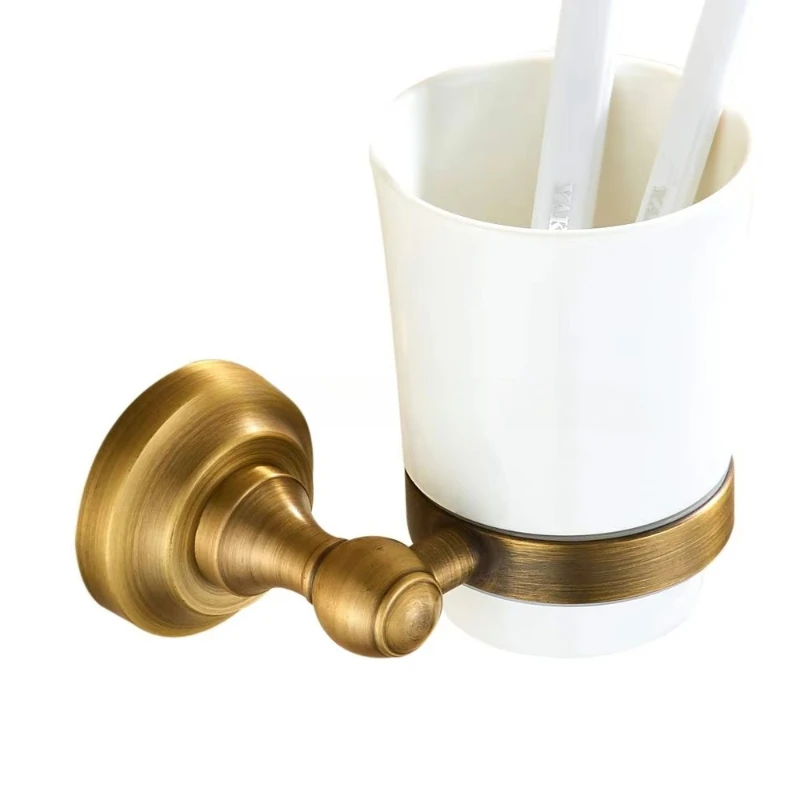 

Metal wall-mounted toothbrush holder with white ceramic mouthwash tumbler antique brass trim round for tissue