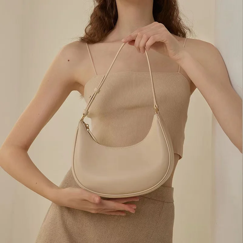 

2024 new cowhide single shoulder half moon bag armpit bag genuine leather women's bag handbag niche white baguette bag