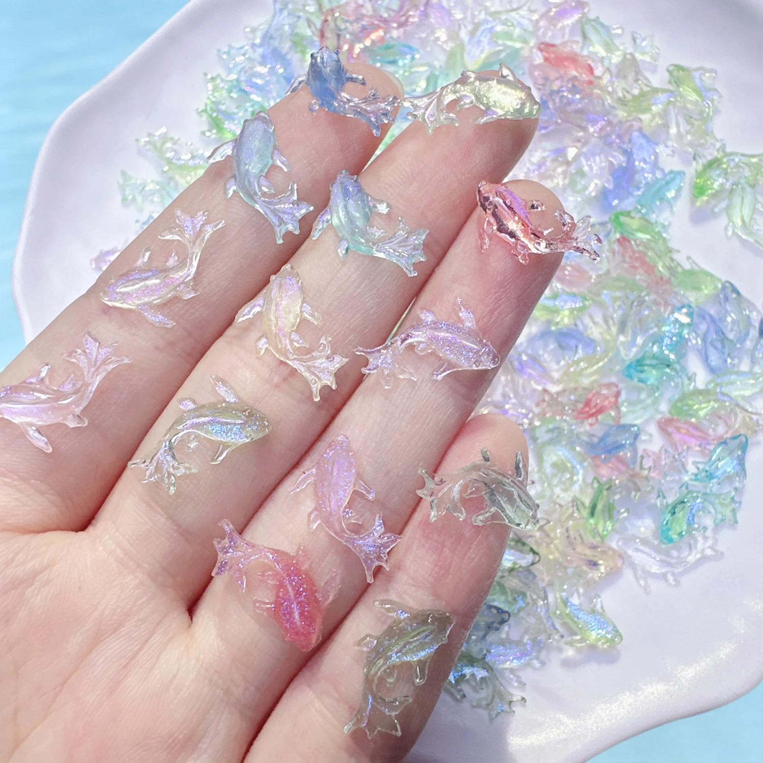 50pcs Aurora Iridescent Resin Fish Nail Charms 3D Shiny Transparent Koi Fish Nail Art Accessories Goldfish Rhinestone Nail Decor view 2