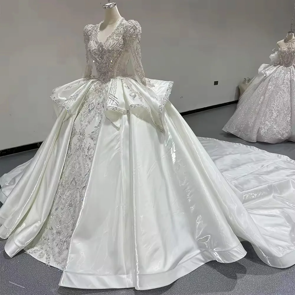 فستان زفاف طويل من Robe De Mariée بأكمام طويلة ورقبة على شكل V مطرز بالخرز من الكريستال برباط علوي وفتحة خلفية فستان زفاف طويل فيستدو دي نوفيا