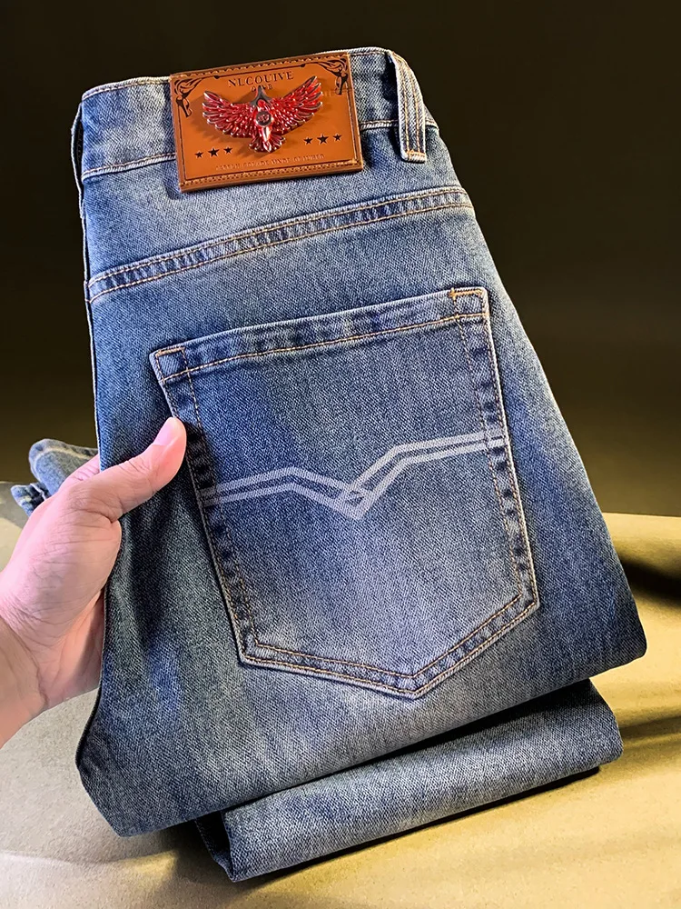 ライトラグジュアリーハイエンドジーンズメンズ秋の新作ブルースリムフィットレトロ弾性カジュアルストリート小脚パンツ男性