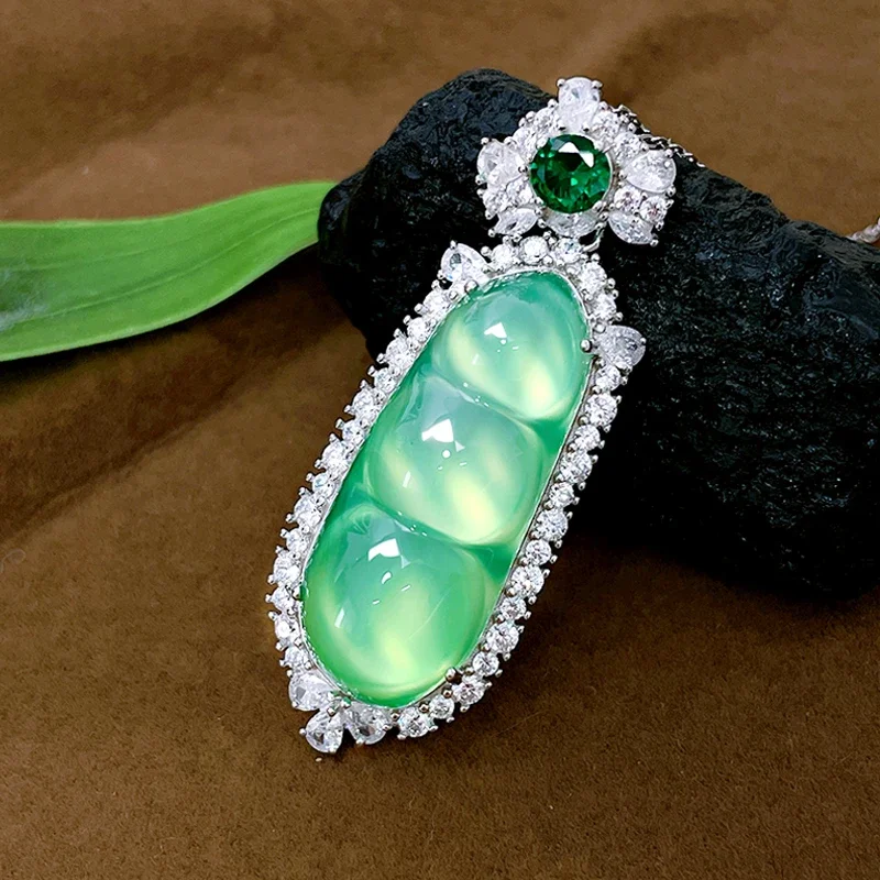 

Desire National Style Green Fluorescent Ice Type Jade Pulp Lucky Bean Necklace 925 Silver Pendant Comparable To Jade