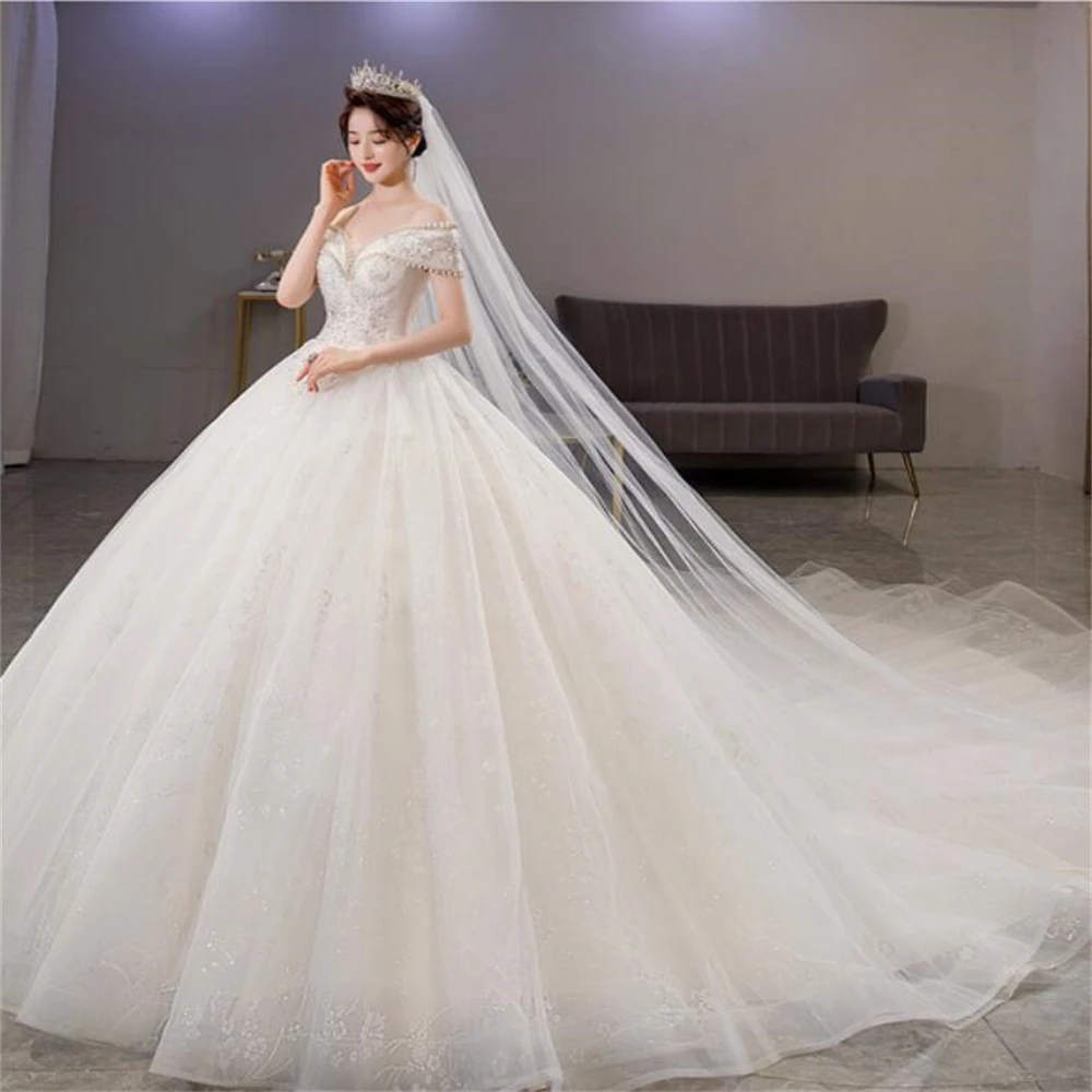 

Customized ZJ4044 Sheer Neck Shiny Tulle Quality Wedding Dress 2025 Ball Gown Style Crystal Beading On Luxury Wedding Dresses