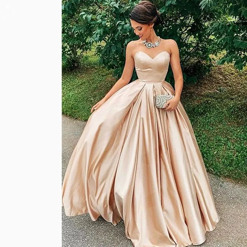 Puffy Een Line Prom Dresses Mooie Sweetheart Backless Champagne Satin Party Wear Custom Made Floor Lenth Ruche Prinses Gown