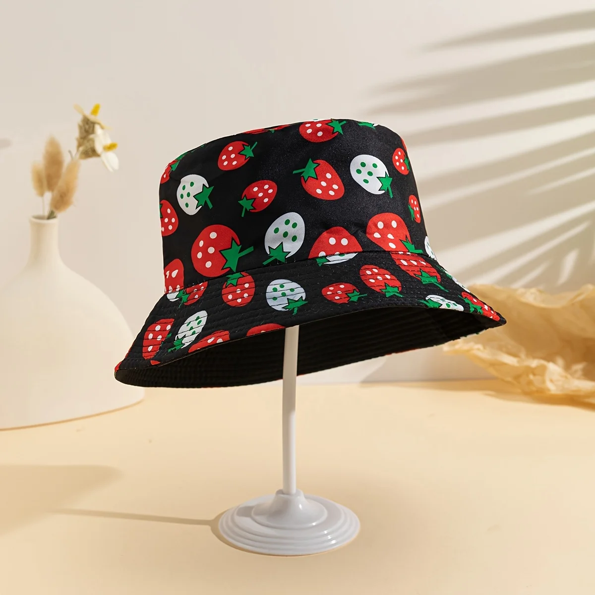 A Single Pack of a Fisherman Hat with Strawberry And Graffiti Designs a Stylish Fishing Hat Suitable for Both Men And Women