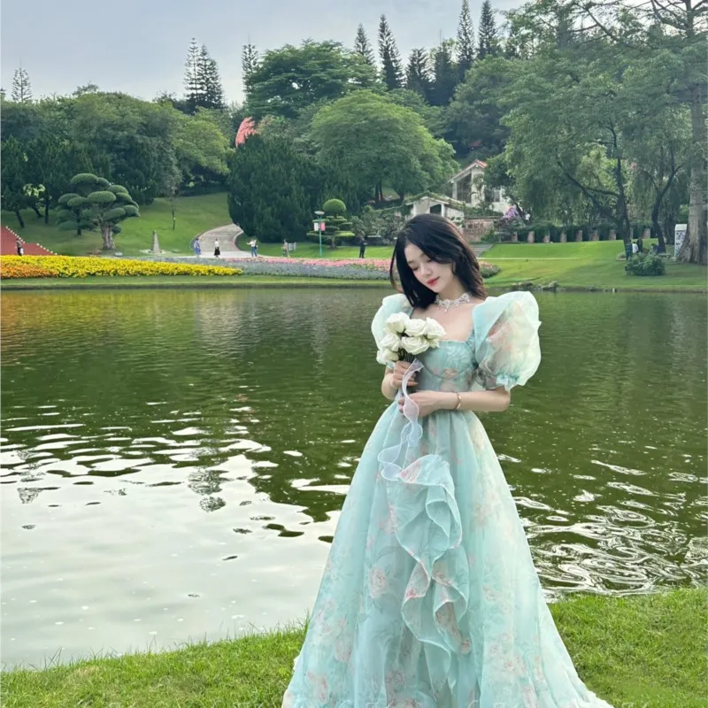 

Lake blue puffy dress with sleeves and train