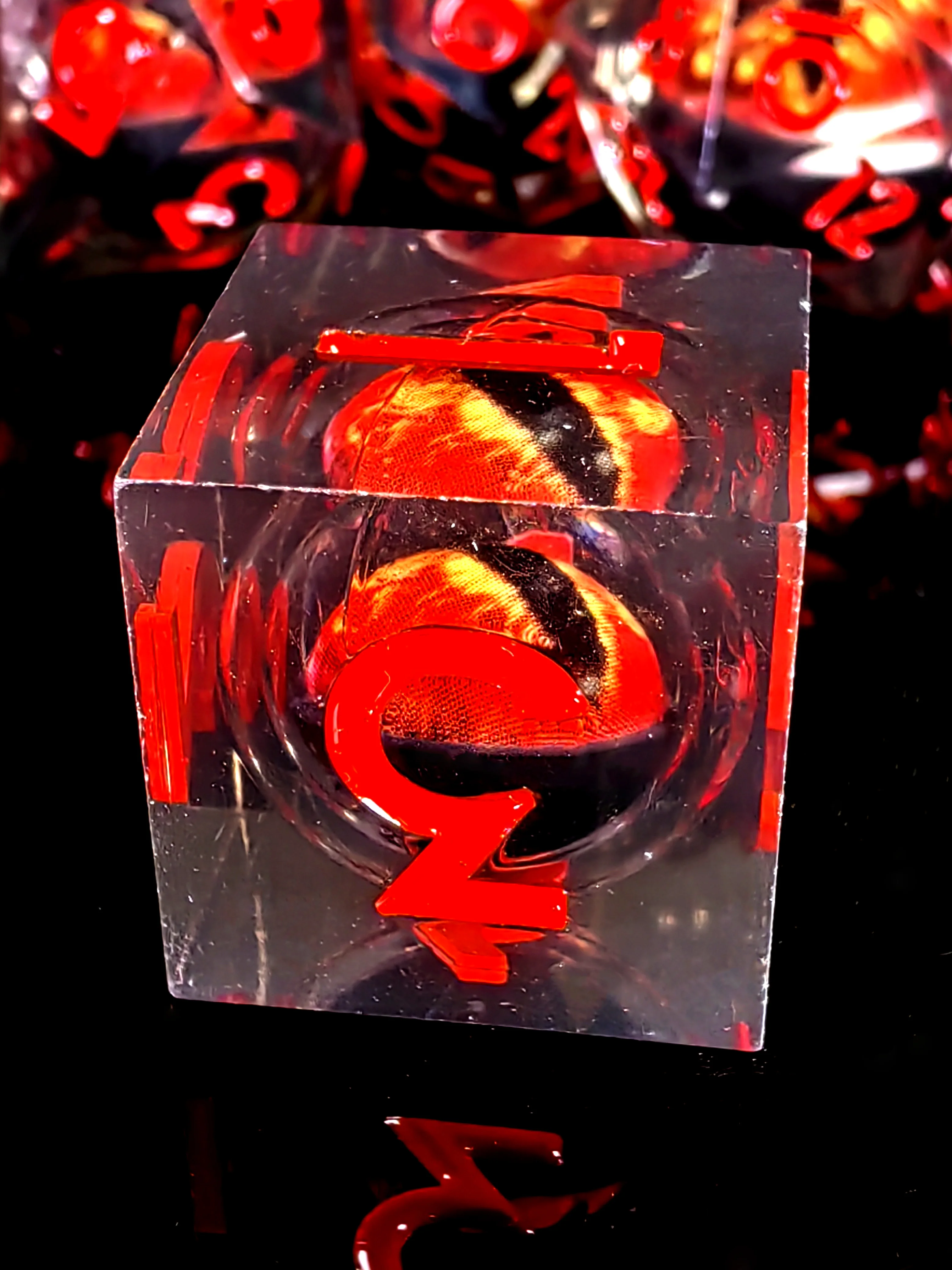 DnD Dice Set - 7-Piece Resin Dice with Spinning Dragon Eye Core, Transparent Base Red Lettering for Tabletop RPG and Board Games