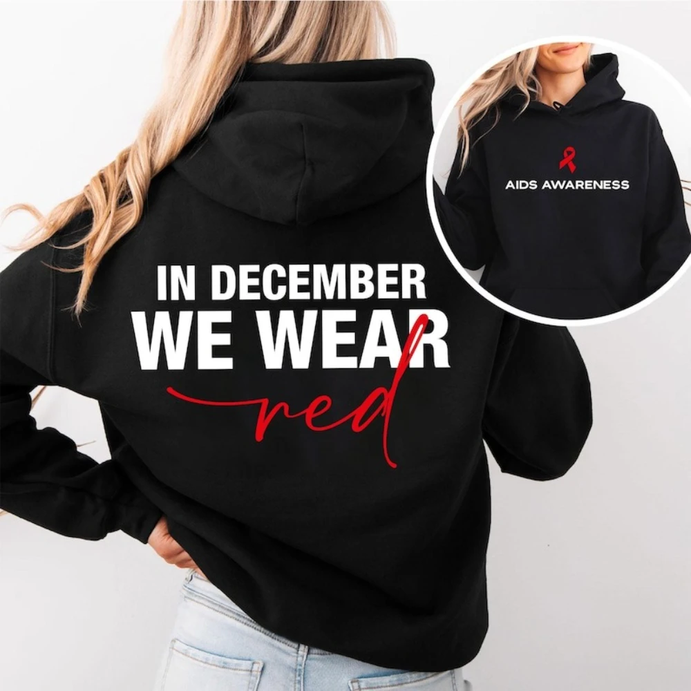 

В декабре Мы носим красную одежду Толстовки с капюшоном с красной лентой и поддержкой для мужчин и женщин Повседневная повседневная уличная одежда