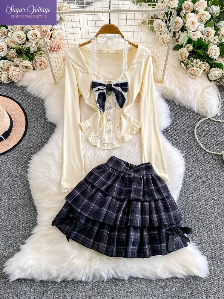 

Французский элегантный комплект из 2 предметов: кружевной топ с бантом на шее + многоярусная юбка в клетку. Сексуальный и шикарный корейский модный комплект. Популярная одежда.