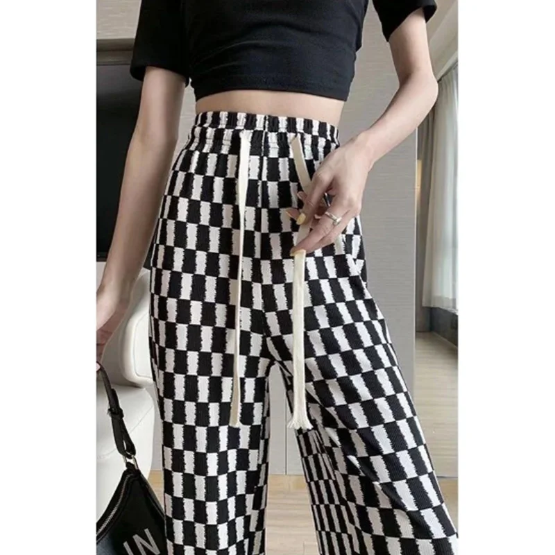 Pantalon en damier pour femme, noir et blanc, en soie glacée, cordon de serrage fin, poches, jambes larges, tendance, printemps été