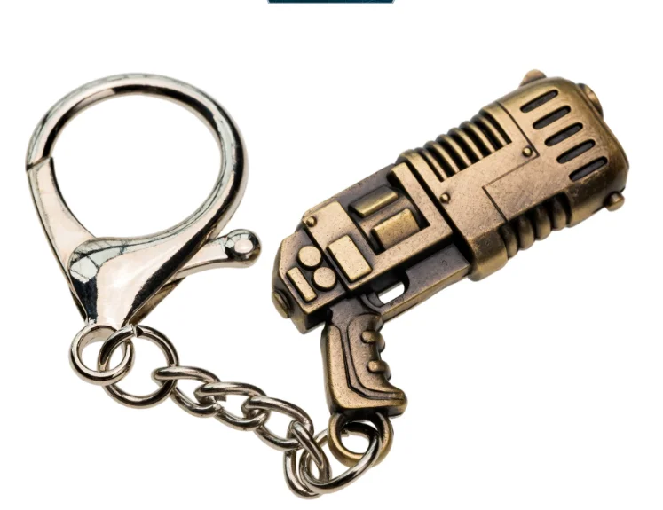 Llavero con pistola de iones Mephisto con dije de fundición de estrellas