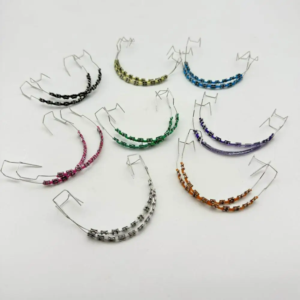 

1 Pair Dental Oral Braces Decoration Colorful Factory Temporary Tooth Decoration with Metal Wires Fake Brackets Ligature Ties