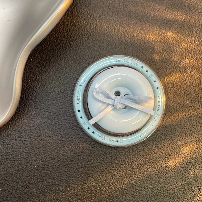 Ins estilo minimalista botão arco airbag suporte desktop volta adesivo nicho universal magsafe suporte magnético para iphone 17 16 15