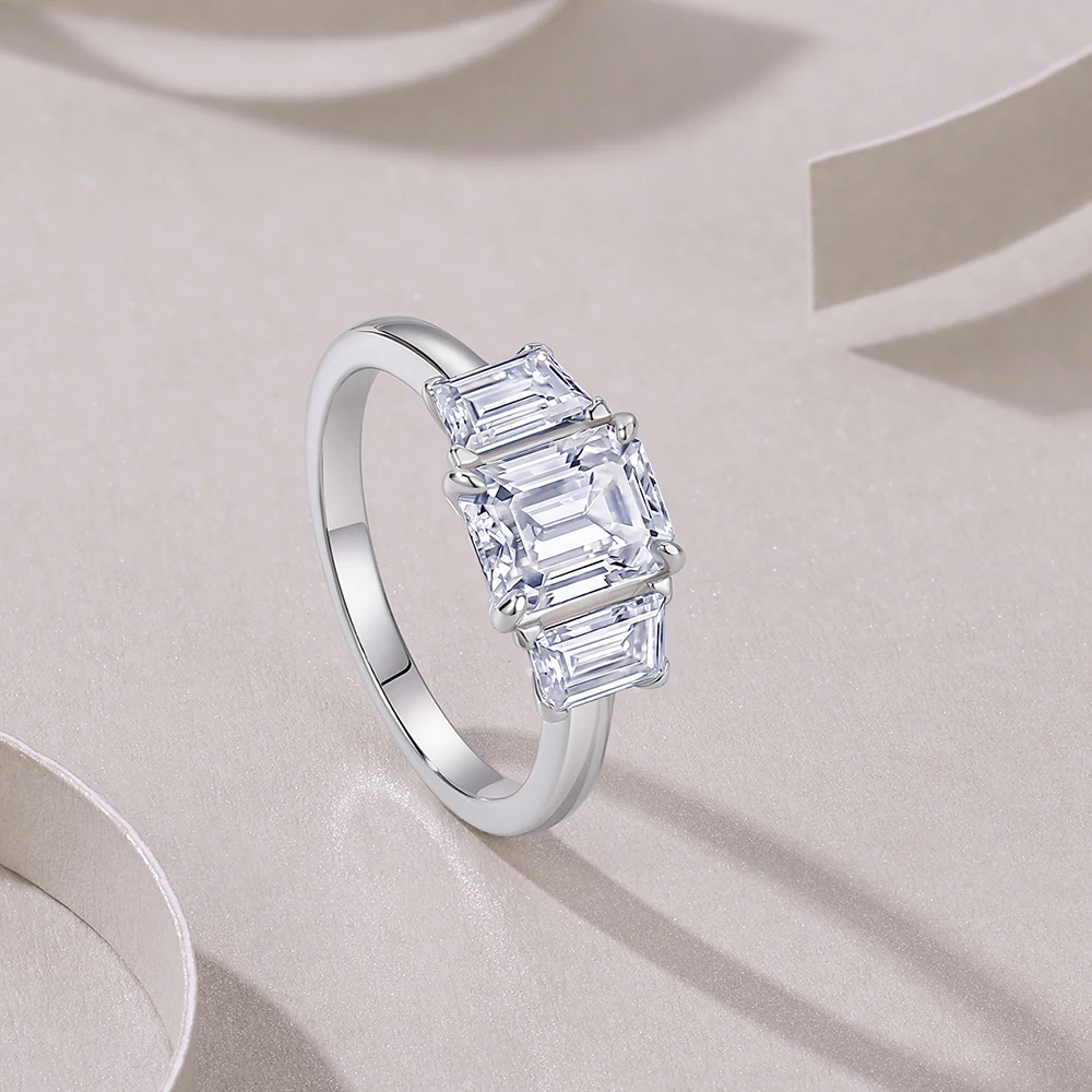 6x8mm Emerald‑Cut Moissanite 3‑Stone Engagement Ring for Women, Side‑Trapezoid Accent Stones, 925 Sterling‑Silver Wedding‑Party‑Ready Band, Fine Jewelry, Ideal Gift for Her