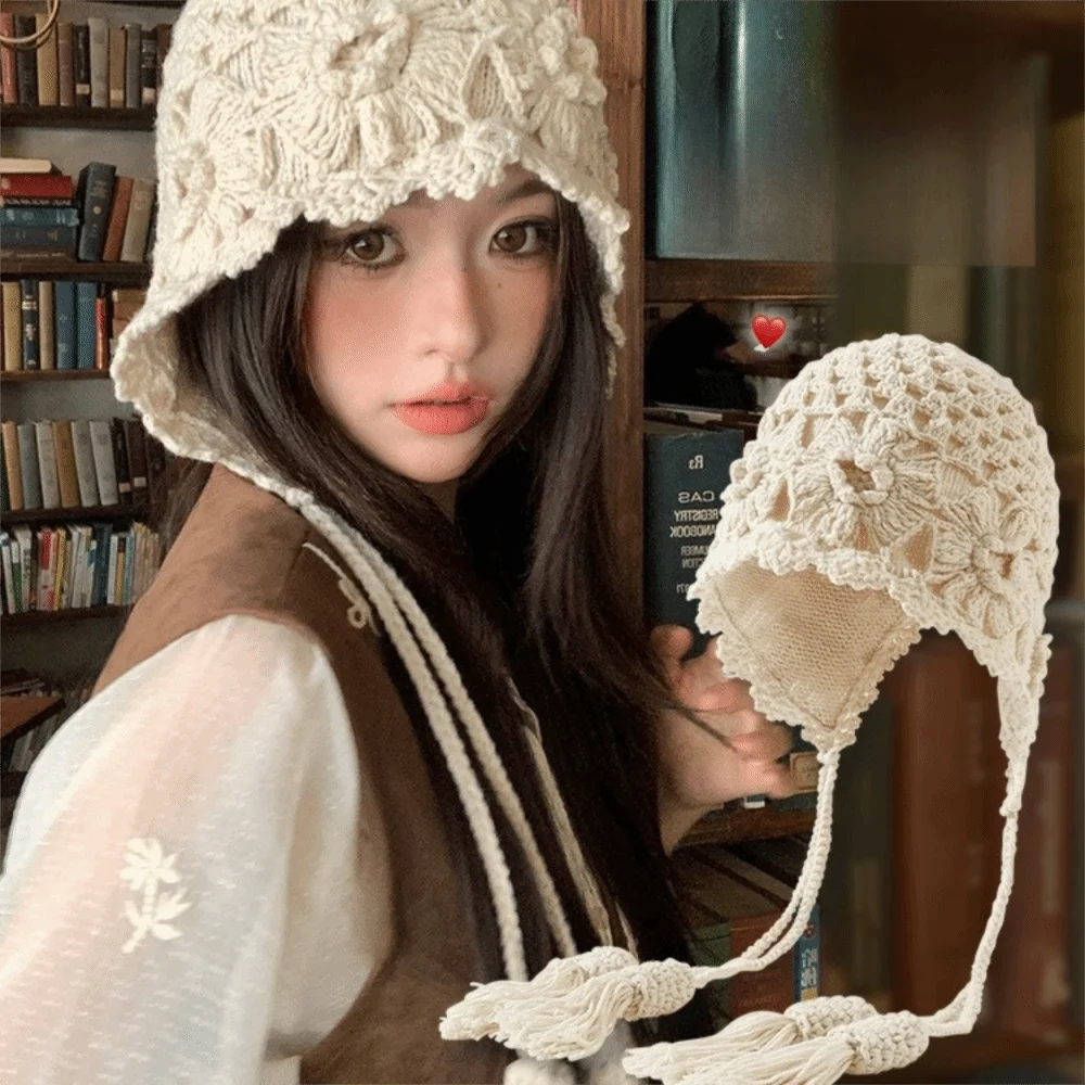 

Fashion Hollowed-out Flower Bonnet Hat Hand Woven Long Tassel Knitted Ear Protection Hat Windproof Crochet Earmuffs Cap
