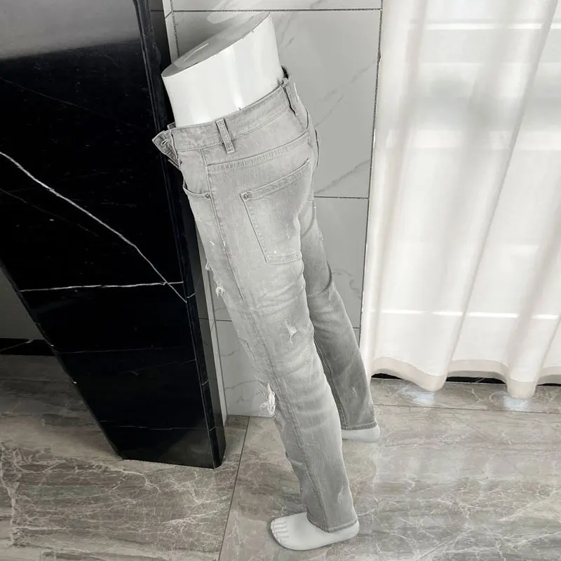 

American designer fashion new dark blue men's jeans washed nostalgic perforated patch elastic slim tapered pants