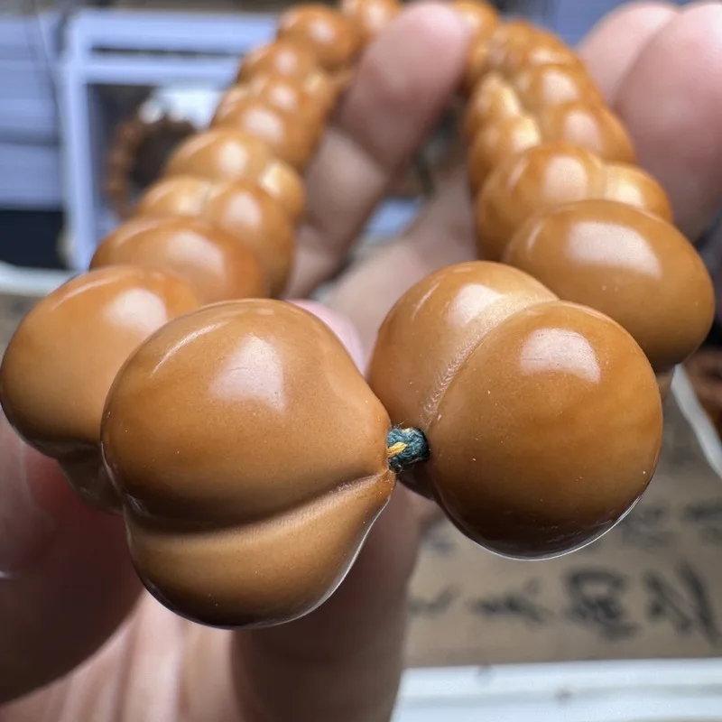 Manufacturer wholesale of hand-carved beads Beijing octagonal monkey head walnut single-strand bracelet 15mm