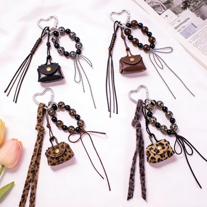 

Новый продукт, горячая распродажа, маленький и милый кожаный кошелек для монет, брелок, кулон с леопардовым узором, бант из бисера, лента, сумка, кулон