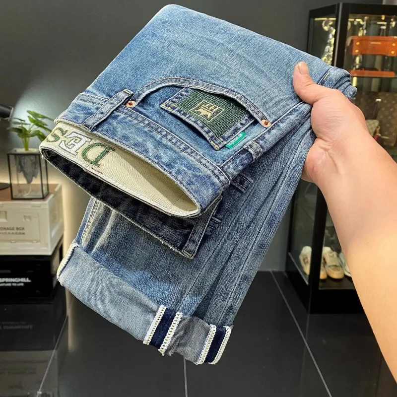 2026 New Collection Men's Light Blue Jeans Washed Denim Slim Fit Versatile Style Three-Dimensional Stitching Embroidered Pockets
