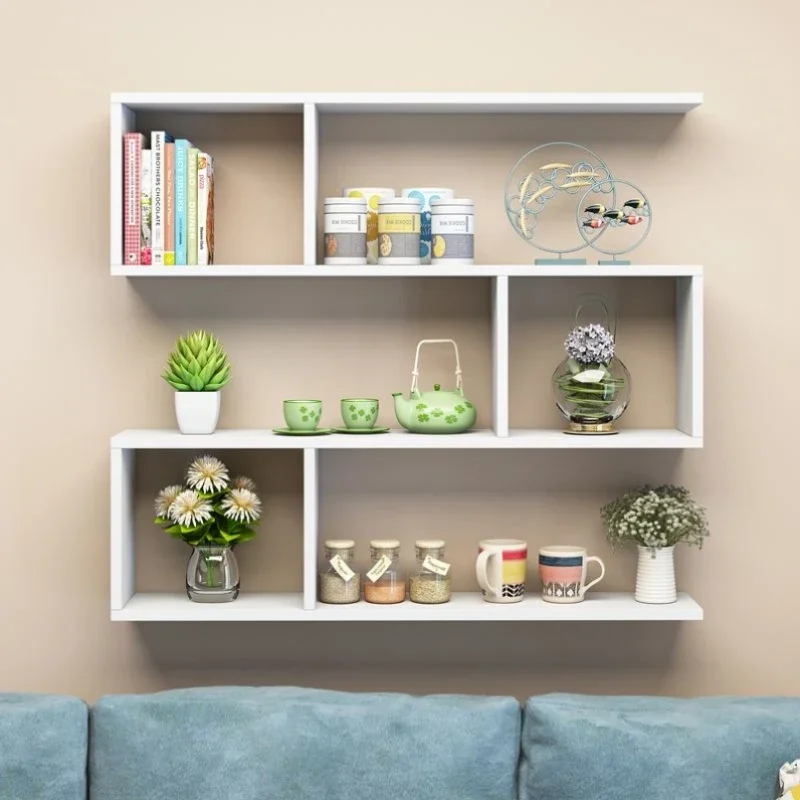 On the wall of the desk, the shelves above wall are fixed with shelves, and mall cabinets on  wall are hung with boo