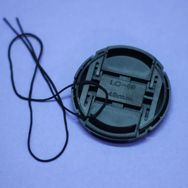 غطاء عدسة الكاميرا مقاس 49 مللي متر ، 100 قطعة ، لكانون نيكون سوني سامسونج سيجما تادرون يونغنيو بنتاكس أوليبومات بانسونيك فوجي فيلم لايكا