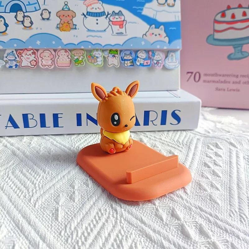 Pokemon Pikachu Supporti per cellulari Kawaii Cartoon Eevee Figura in PVC Supporti per telefono Telefono da tavolo Porta TV Accessori Regalo per ragazze