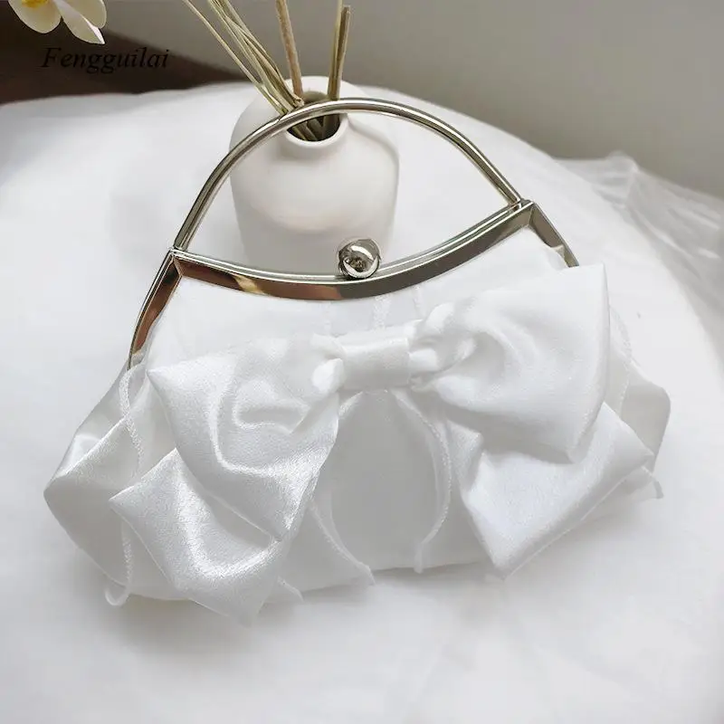 

A French-Style Silk-Shaped Hand-Held Cross-Body Bag, Made of Pleated Fabric, with Adjustable Bow Loops