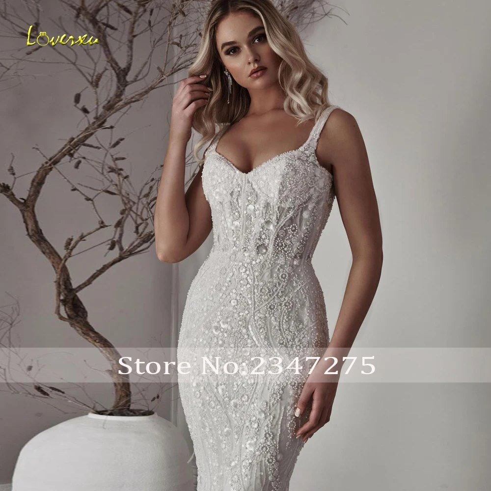 Loverxu حورية البحر فساتين زفاف مثيرة على شكل قلب بدون أكمام فيستدو دي نوفيا دانتيل مطرز لامع مصنوع حسب الطلب فستان زفاف