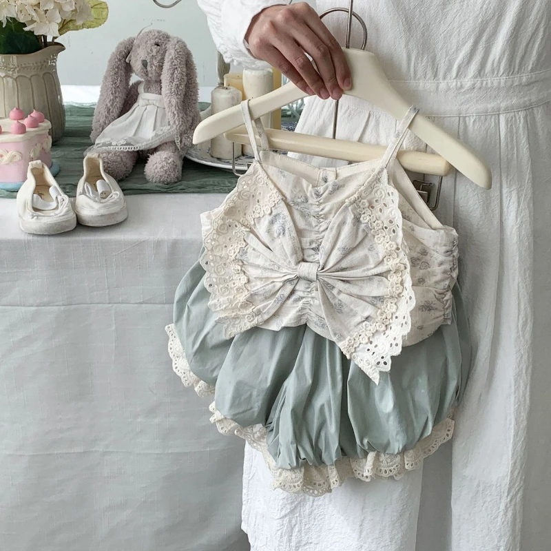 

New Summer Collection 2025 for Girls: Floral Bow Tie Sleeveless Top and Fashionable Bloomers Shorts.