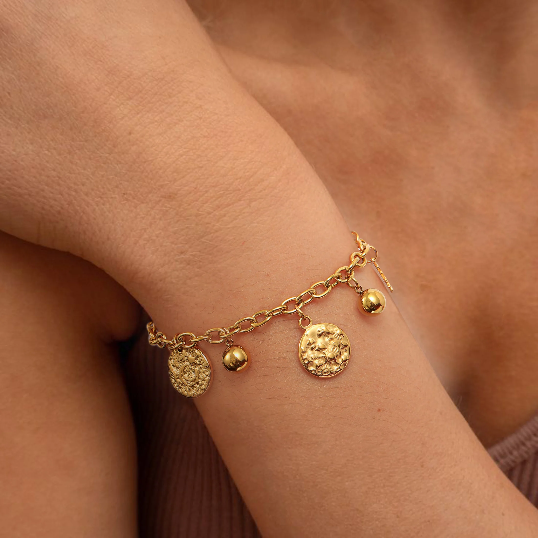

Golden Tone Stainless Steel Sun and Moon Charm Bracelet for Women
