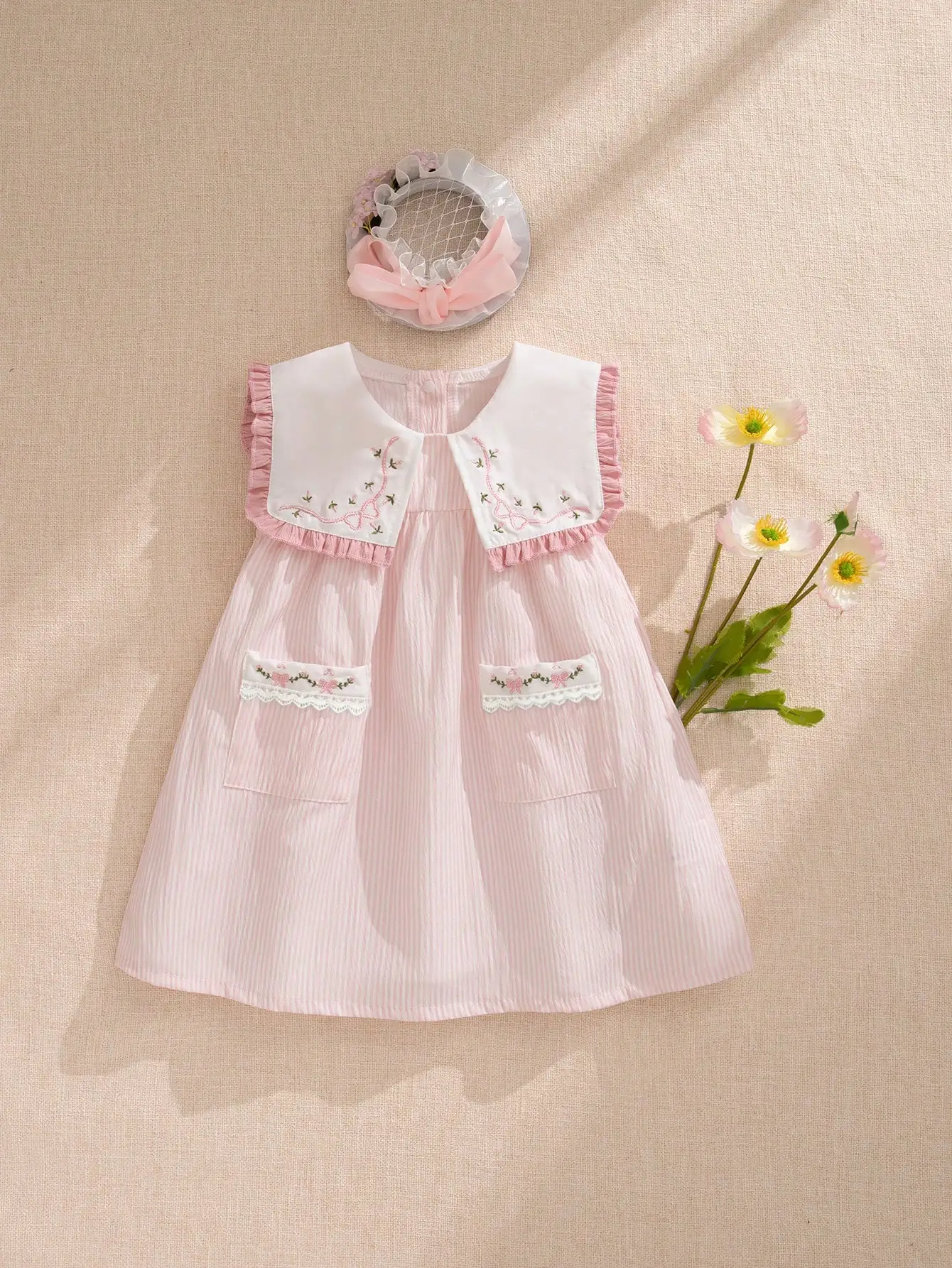

Pink Pleated Baby Girl Dress with Embroidered Peter Pan Collar and Floral Pockets