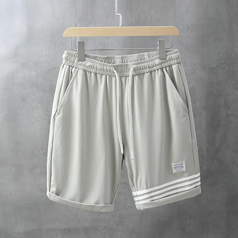 

Новые летние модные мужские повседневные шорты, вязаные спортивные штаны, шелковые крутые удобные брюки с пятью точками, свободные прямые