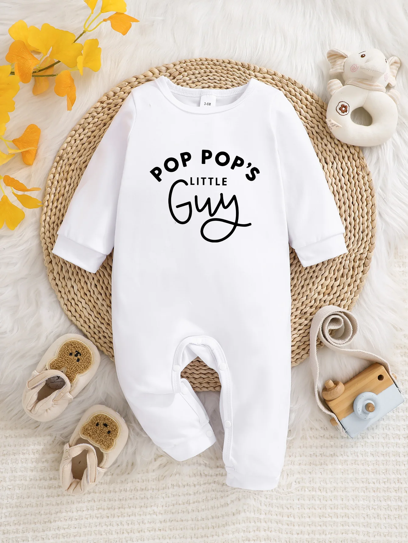 Baby long-sleeved bodysuit with fun letter prints, button design, easy care, suitable for new parents.