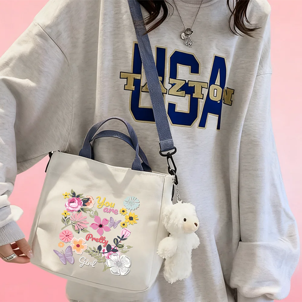 Handbags and crossbody bags featuring butterfly-in-bloom patterns—perfect for travel, vacations, and organizing cosmetics.