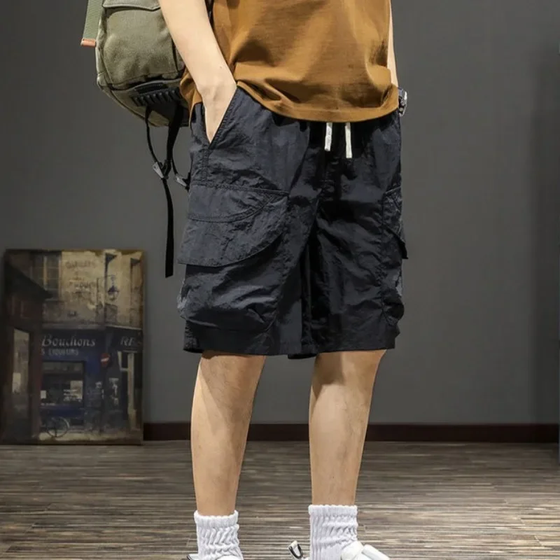 

Мешковатые длинные эластичные шорты с широкой талией и завязками, однотонные карманы, мужские короткие брюки, свободные черные бермуды, мужские шорты-карго, полуповседневные