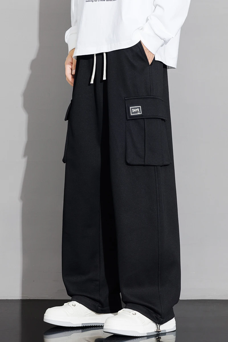 Męskie spodnie dresowe o prostym kroju, typu joggers, do sportu i streetwearu, luźne, oversize'owe, z długimi nogawkami, ze sznurkiem, męskie spodnie z wieloma kieszeniami.