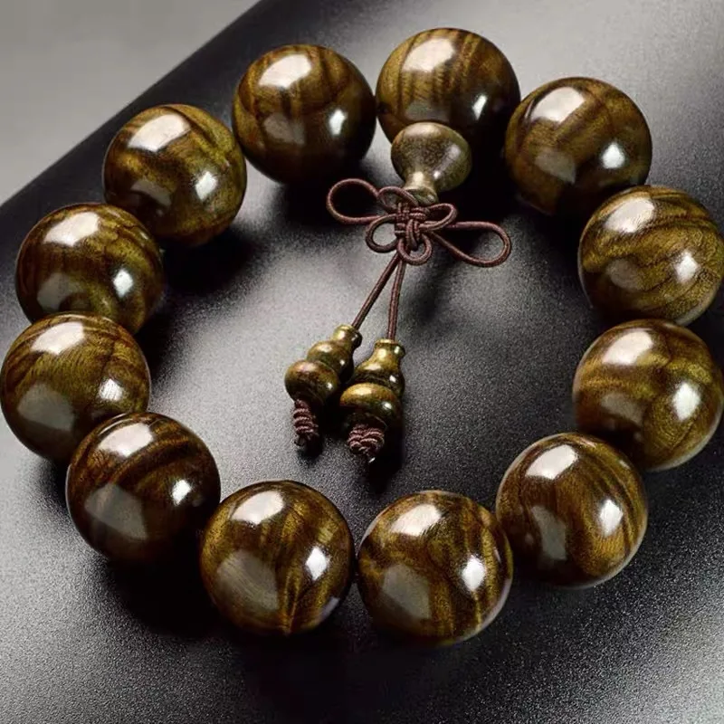 

Sichuan golden nanmu bracelet for men, with rich water ripple and gentian pattern, Buddhist beads, dark wood ebony green bracele
