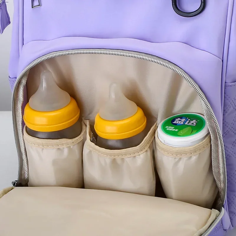 กระเป๋าเดินทางอเนกประสงค์กันน้ำพร้อมแผ่นรองเปลี่ยนผ้าอ้อม สายรัดรถเข็นเด็ก ขนาดใหญ่สำหรับคุณแม่ กระเป๋าเป้ใส่ผ้าอ้อมเด็ก อุปกรณ์จำเป็นสำหรับเด็ก