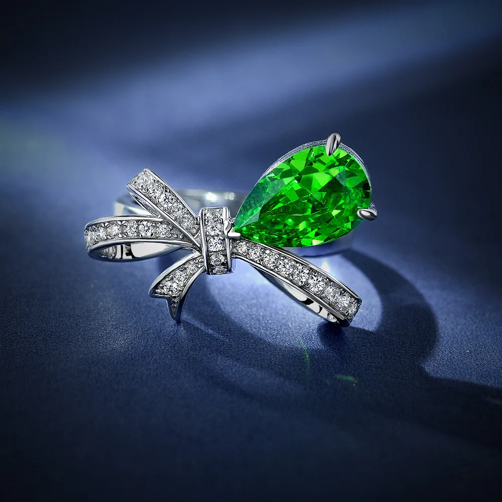 

New fashion trend S925 inlaid 5A zircon glazed emerald ribbon bow diamond ring emerald green drop shape women's ring