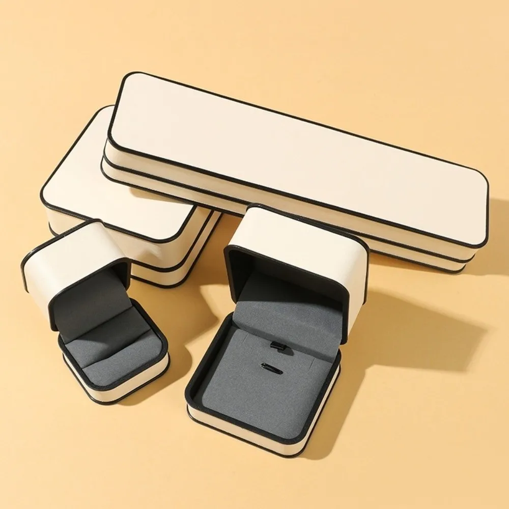 

Модная высококачественная шкатулка для колец с бархатной подкладкой, бежевая шкатулка для драгоценностей из искусственной кожи с круглым углом, черная рамка, дизайн, кольцо, браслет, ожерелье, органайзер