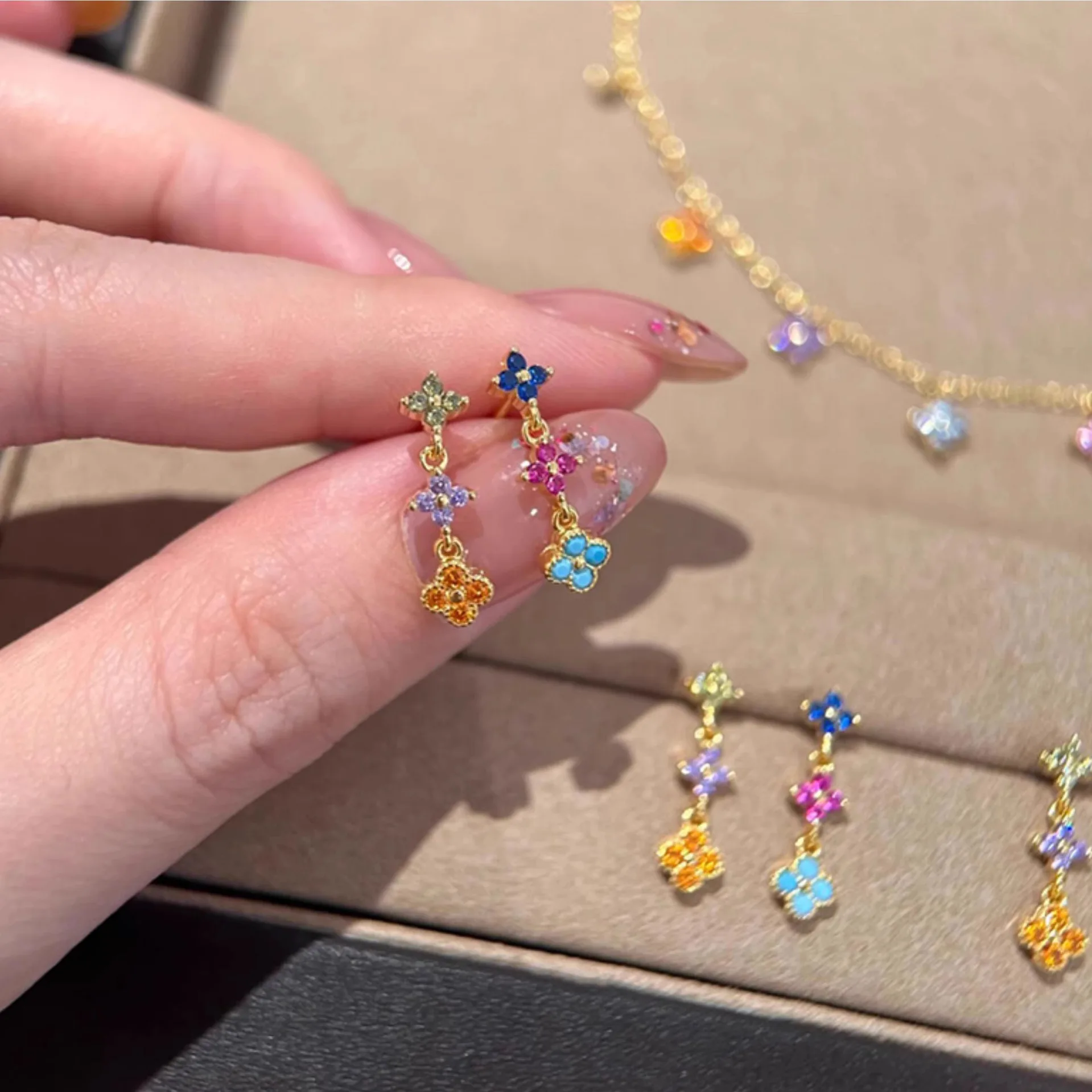 The same color zirconium four-leaf clover tassel earrings light luxury high-end temperament earrings women's unique beautiful ea
