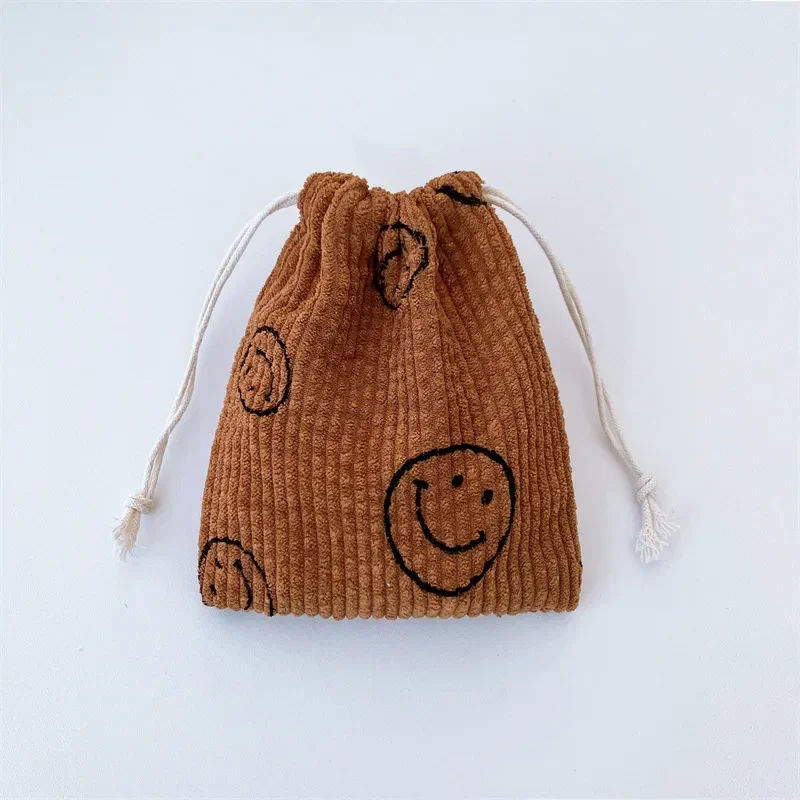 Smiling Face Corduroy Drawstring Bag กระเป๋าแต่งหน้าผู้หญิงกระเป๋าเครื่องสําอางแบบพกพาเหรียญ Draw String กระเป๋ากระเป๋าสําหรับสตรี