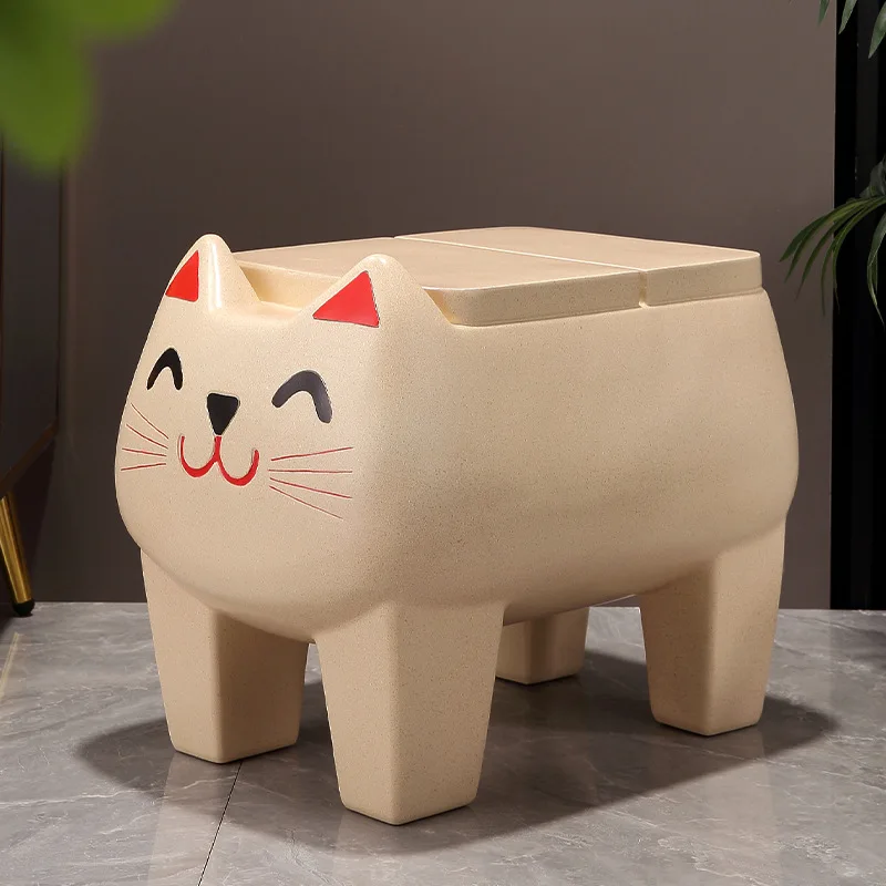 

Cute cartoon animal changing shoes sitting on a stool next to the TV cabinet at the entrance of the living room