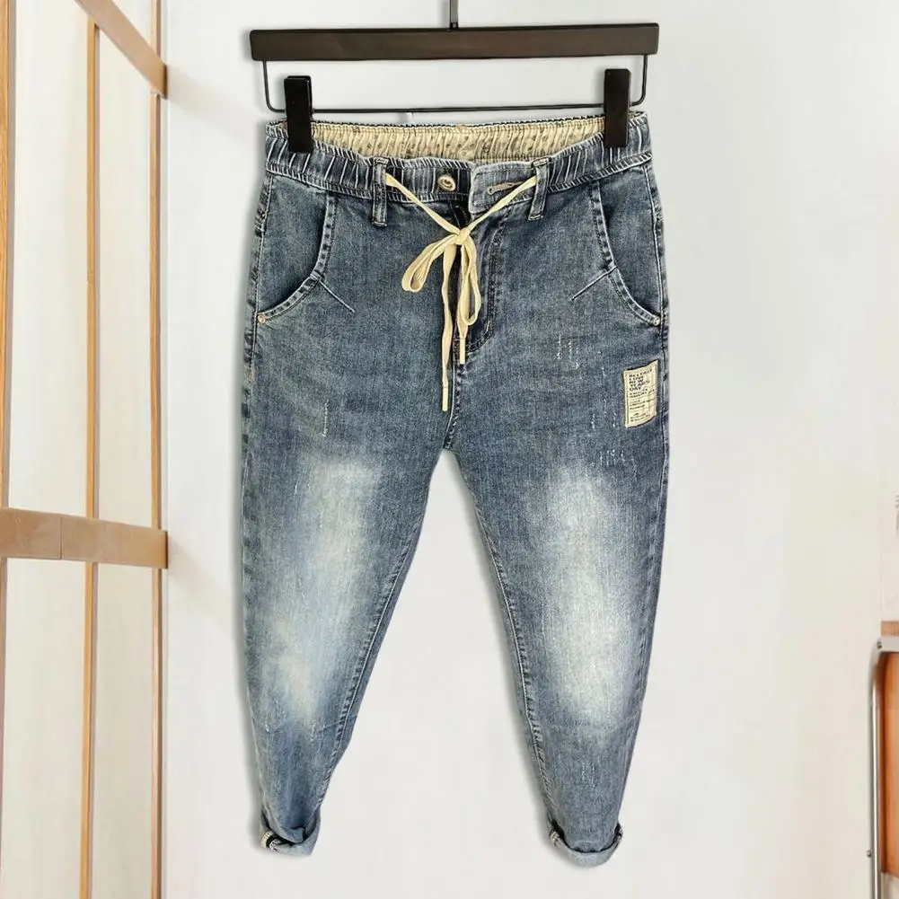 Jeans harém estilo hip-hop masculino, elástico na cintura, cordão ajustável, calças jeans com zíper, bolsos para um